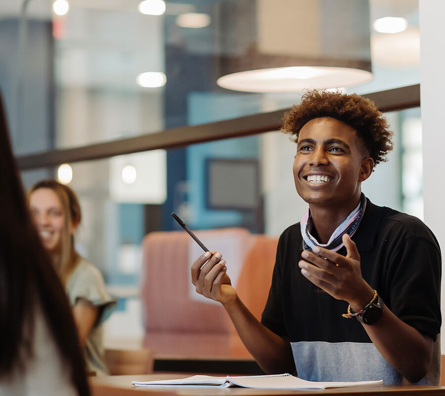 Education student engages in classroom discussion.